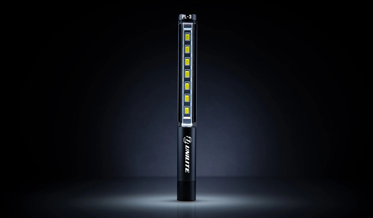 Unilite PL-3 slim LED inspection light for checking vehicle paintwork during professional car cleaning and detailing.