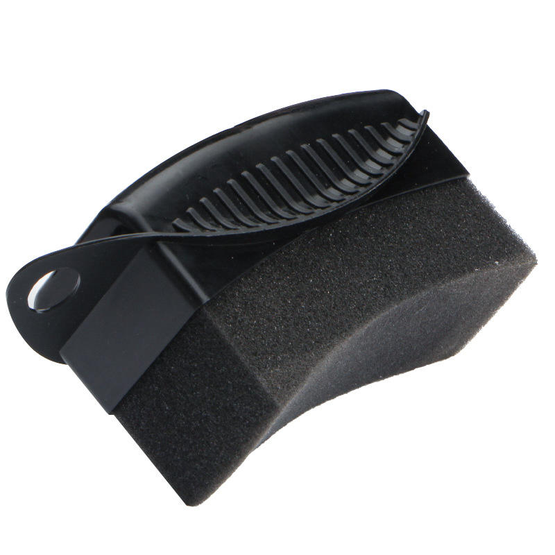 Black car tyre dressing applicator with a dual-sided design featuring a textured foam sponge block and a ribbed plastic scraper edge.