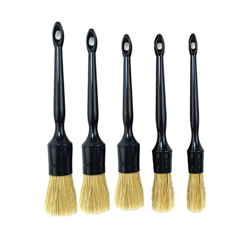 Five black-handled car detailing brushes with natural hog hair bristles, used for car cleaning and detailing.
