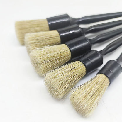 Five black handled car cleaning brushes with natural hog hair bristles, used for car cleaning and detailing.