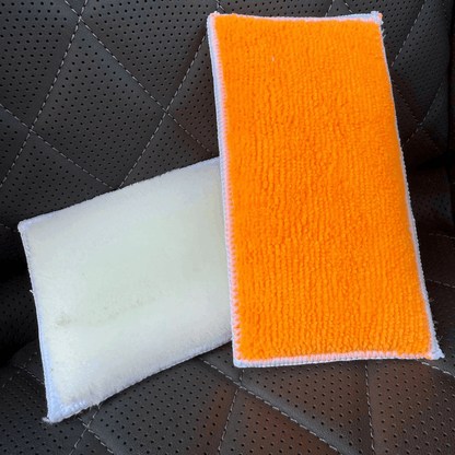 Dual-sided car detailing wash pad with soft white microfibre and orange cleaning surface, designed for safe and effective vehicle washing.
