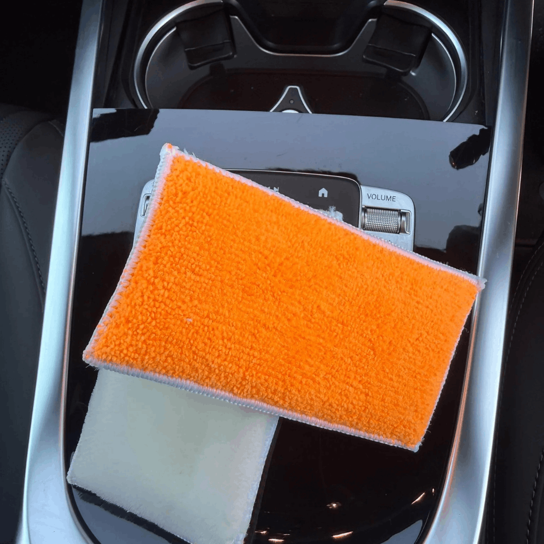 Orange dual-sided microfibre cleaning pad for car interior detailing, ideal for cleaning dashboards, centre consoles and interior surfaces.