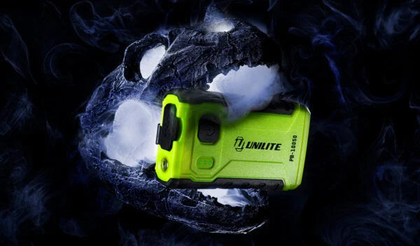 Unilite rechargeable powerbank LED work light with high-visibility casing, shown in wet and rugged conditions for professional detailing and workshop use.