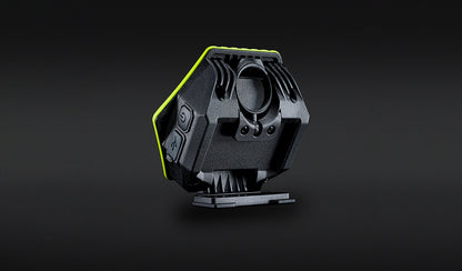 Unilite HX-1080 rechargeable LED work light with bright green protective casing, mounted on a black workshop panel.