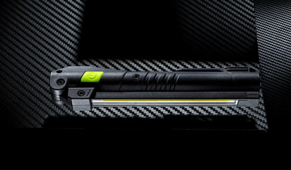 Unilite rechargeable LED inspection light held in a work glove for professional electrical work.