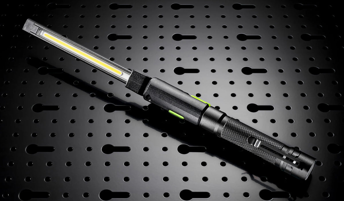 Two compact Unilite rechargeable work lights with folding LED arms for car cleaning, detailing and paintwork inspection.