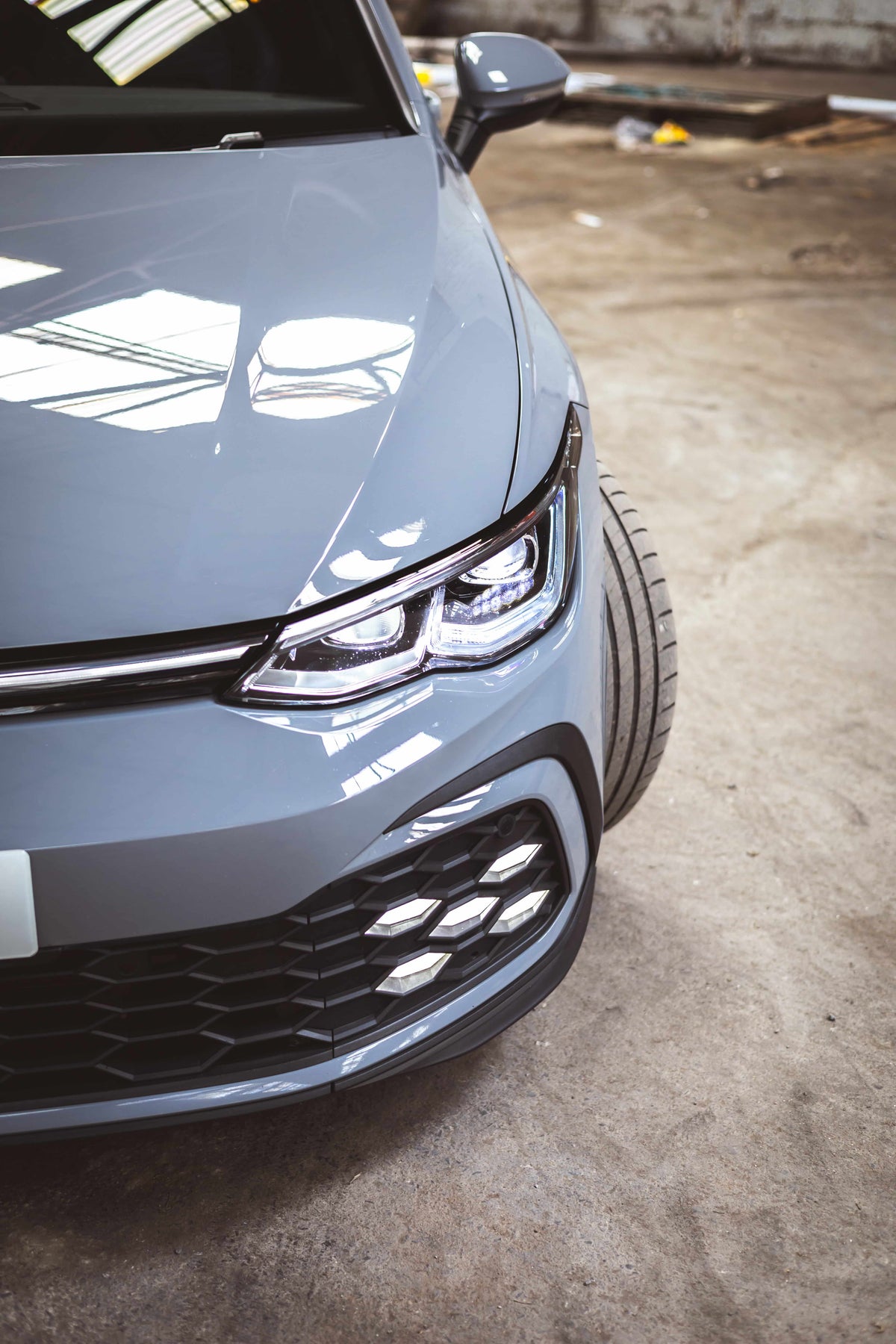 Freshly detailed grey Volkswagen Golf with a high-gloss paint finish after machine polishing and ceramic coating. Professional car detailing showcasing swirl-free paintwork, enhanced gloss, paint correction and premium automotive valeting.